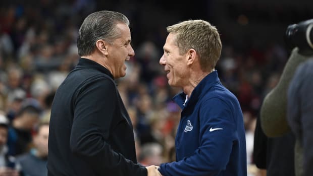 Nov 20, 2022; Spokane, Washington, USA; Kentucky Wildcats head coach John Calipari, left, shakes hands with Gonzaga Bulldogs head coach Mark Few before a game at Spokane Arena. Mandatory Credit: James Snook-USA TODAY Sports  